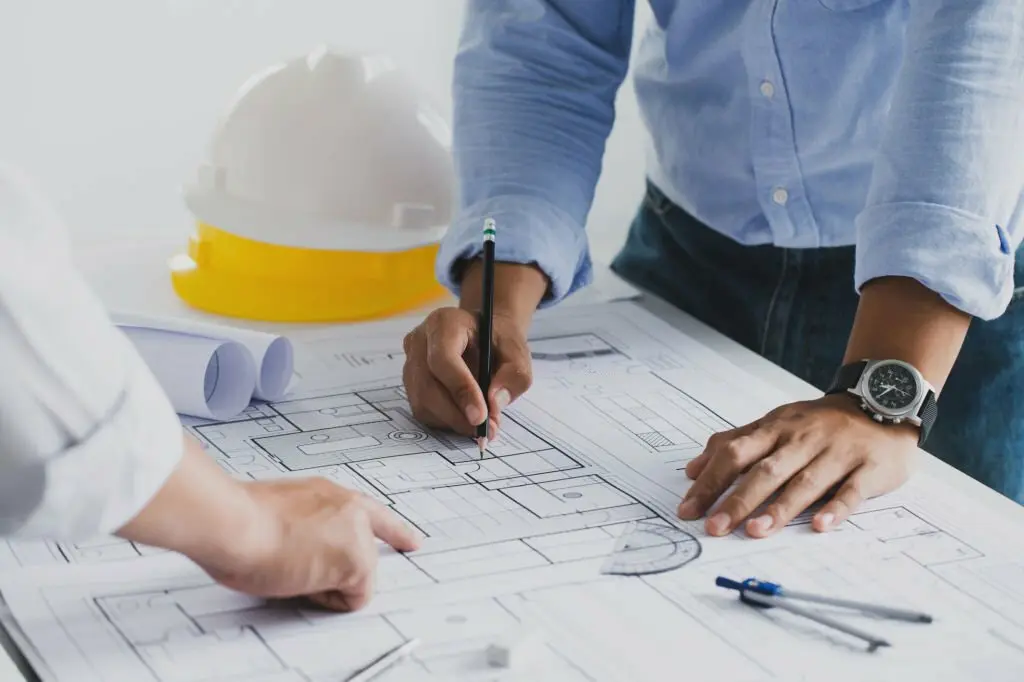 Engineering consultants planning and managing project stages efficiently