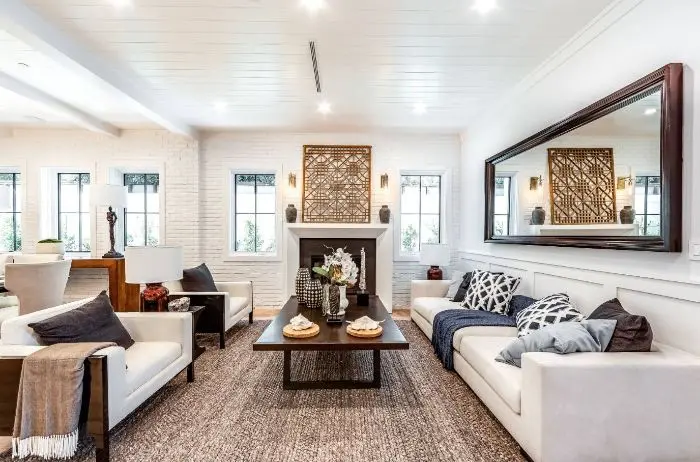 White modular couch in a contemporary living room, designed by DAT Interior Design.