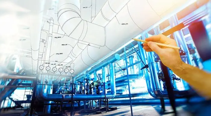 Engineers inspecting mechanical, electrical, and plumbing systems at a construction site.