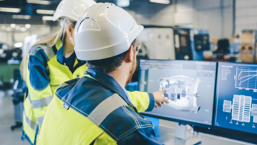 Consultants reviewing building systems and managing facilities operations for optimized performance.